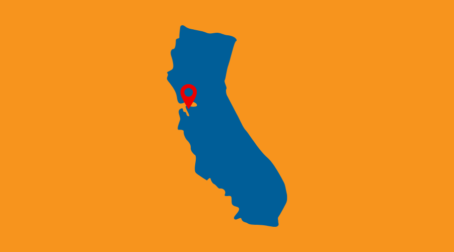 silhouette of the state of California on orange background